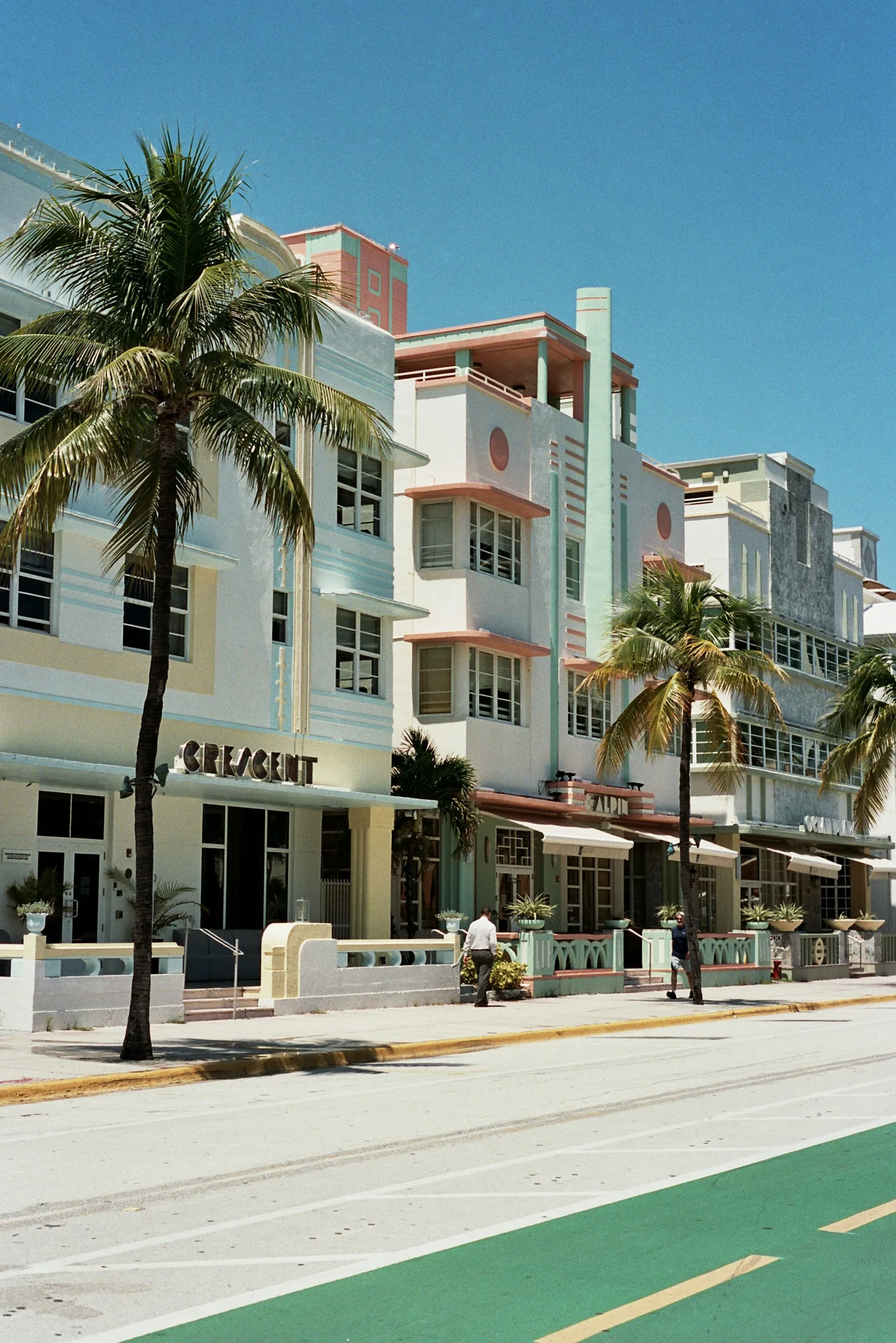 Pastel Art Deco facade and palms in Miami Beach